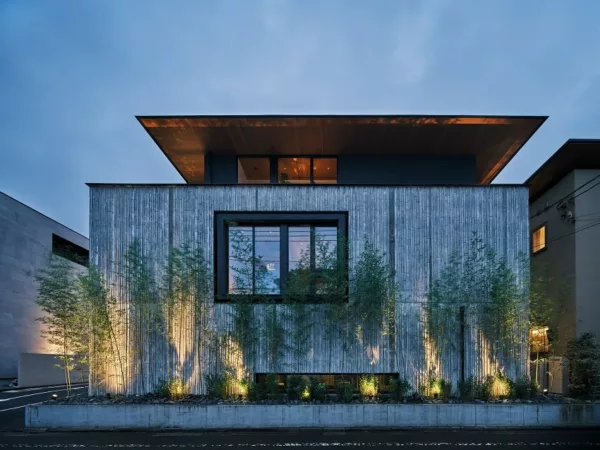 Outside view of C4L, a modern architectural creation in Japan as dusk sets in.