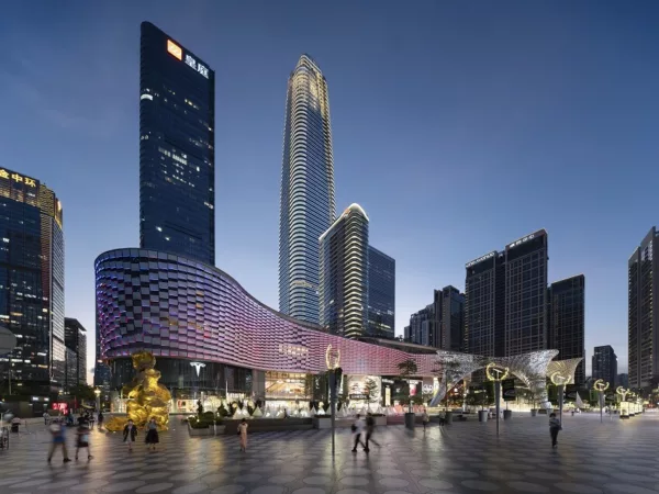A mesmerizing nighttime view of SHENZHEN CENTER, illuminated against the dark sky.